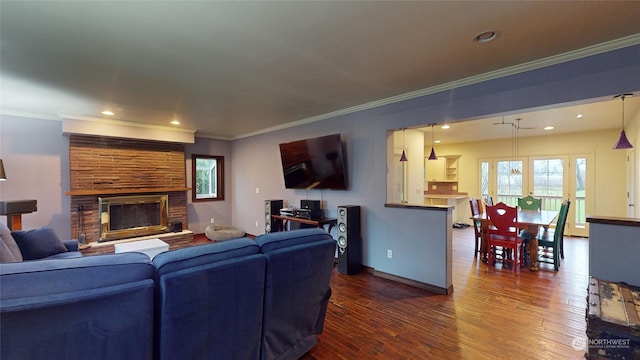 living room featuring dark hardwood / wood-style flooring and ornamental molding