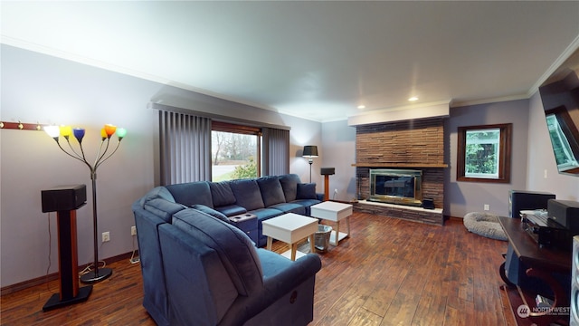 living room with a fireplace, dark hardwood / wood-style floors, and ornamental molding