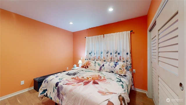 bedroom featuring a closet and light wood-type flooring