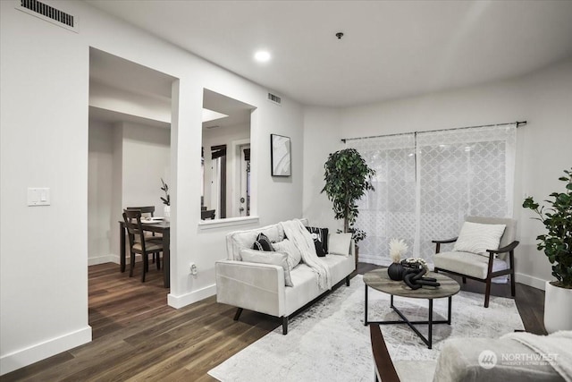 living room with dark wood-type flooring