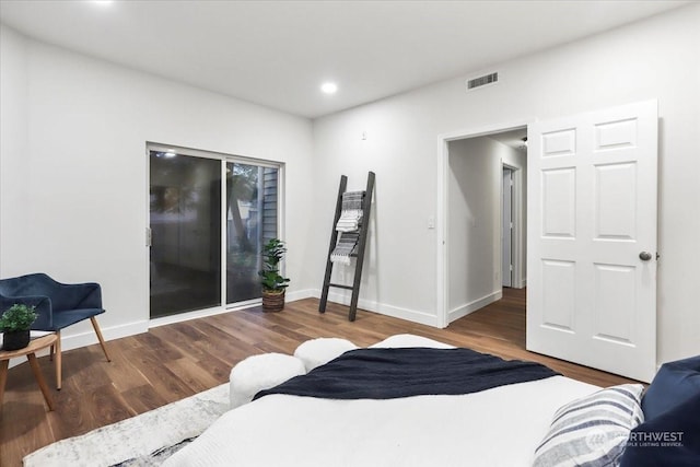 bedroom with wood-type flooring