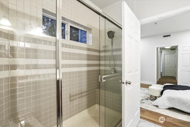 bathroom with a shower with shower door