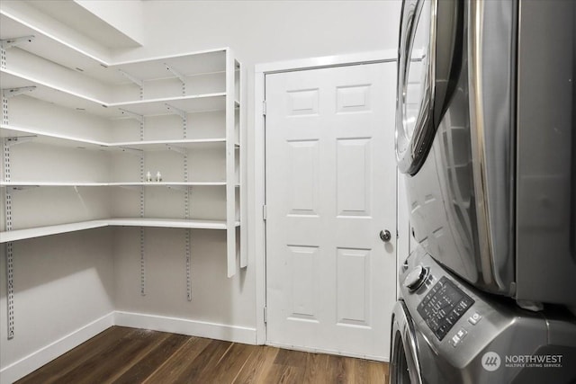 pantry with stacked washing maching and dryer