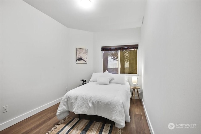 bedroom featuring dark hardwood / wood-style floors