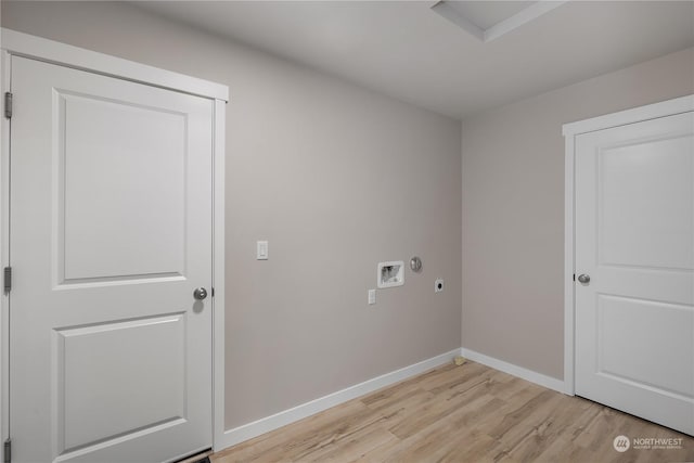 clothes washing area featuring washer hookup, light wood-type flooring, and hookup for an electric dryer