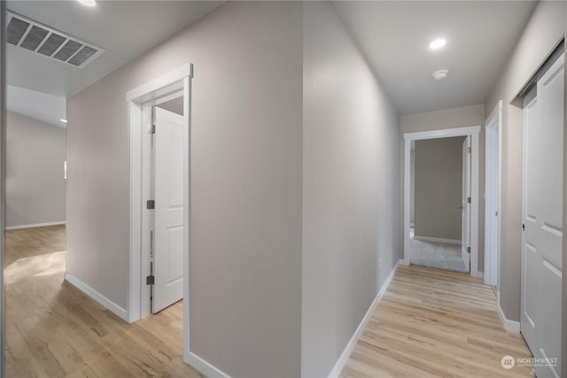 corridor featuring light wood-type flooring