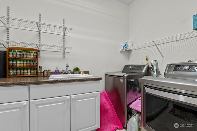 laundry room featuring sink and washer and dryer