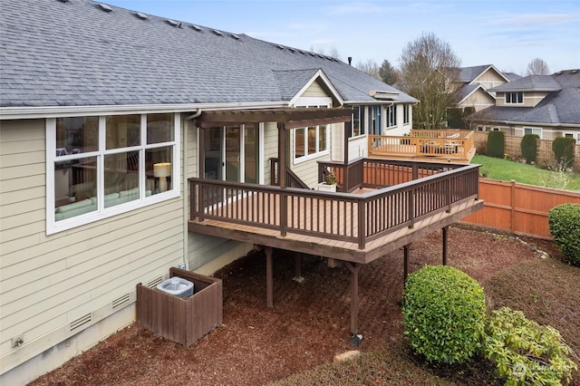 rear view of property featuring a deck