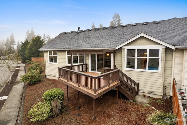 back of house featuring a deck