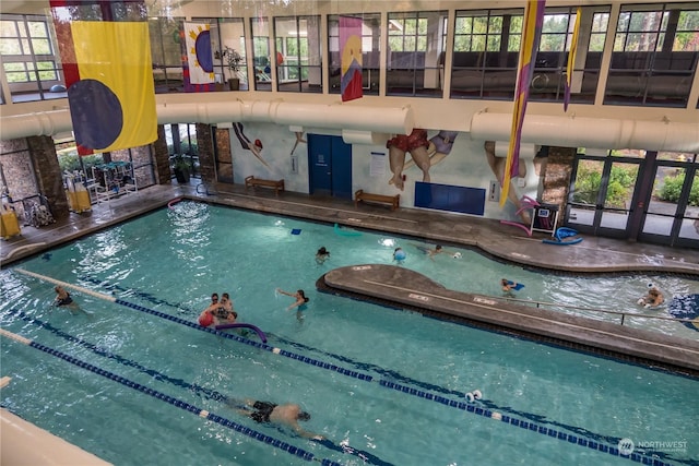 view of pool featuring french doors