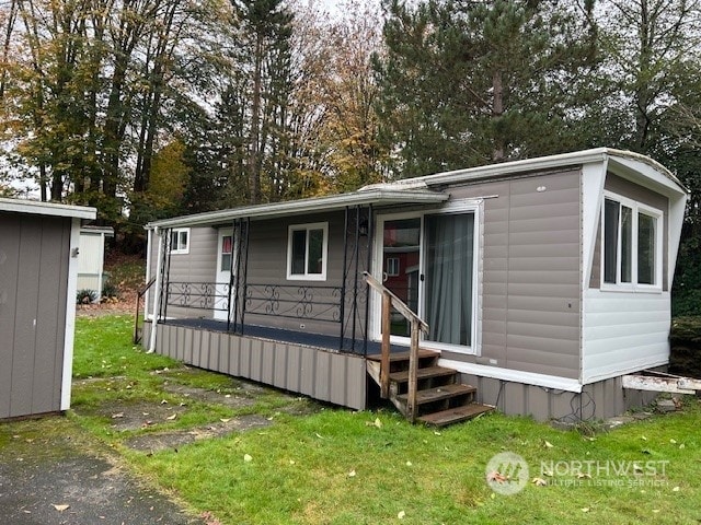 view of outdoor structure with a yard