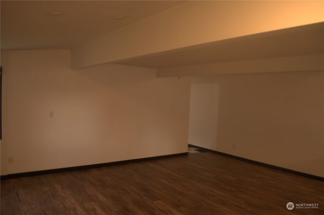 empty room featuring dark wood-type flooring