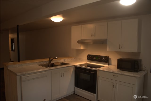 kitchen featuring white cabinets, white appliances, and sink