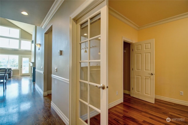 hall featuring french doors, dark hardwood / wood-style floors, and ornamental molding