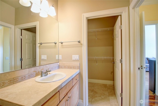 bathroom featuring tile patterned flooring and vanity