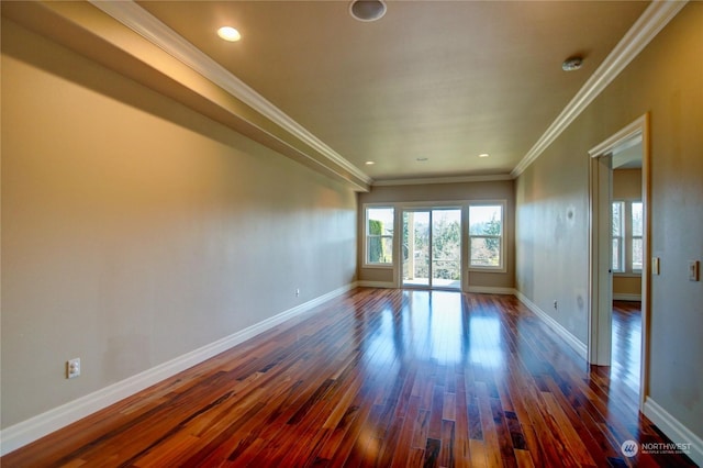 unfurnished room featuring dark hardwood / wood-style floors and crown molding