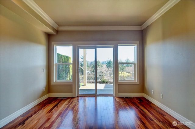 entryway featuring hardwood / wood-style flooring and crown molding