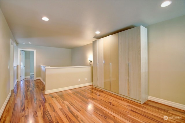 spare room with light hardwood / wood-style flooring