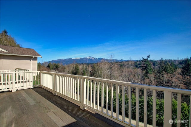 wooden terrace featuring a mountain view