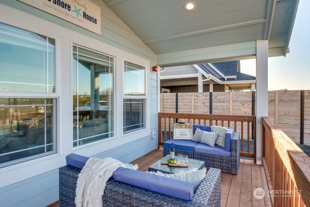 exterior space featuring an outdoor hangout area and a deck