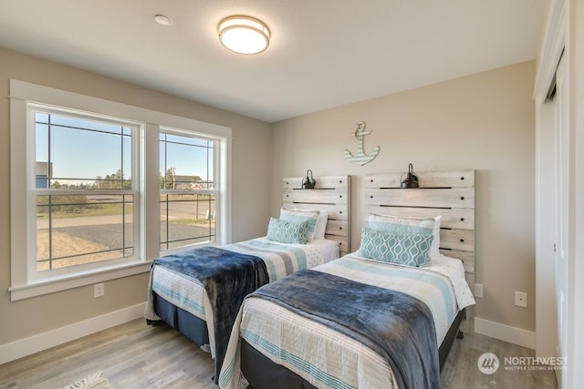 bedroom with light wood-type flooring