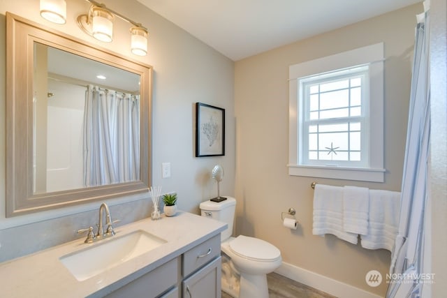 bathroom with vanity and toilet