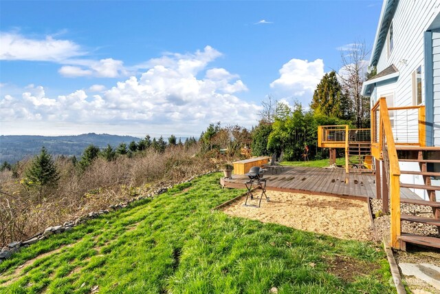 view of yard featuring a wooden deck