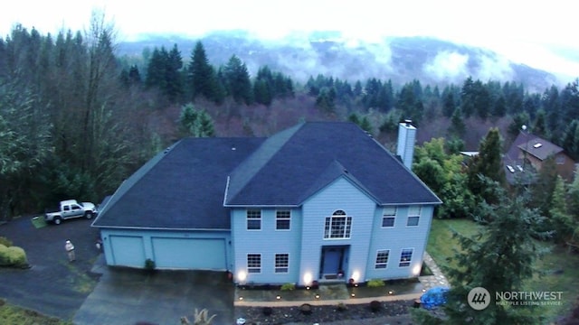 aerial view with a wooded view