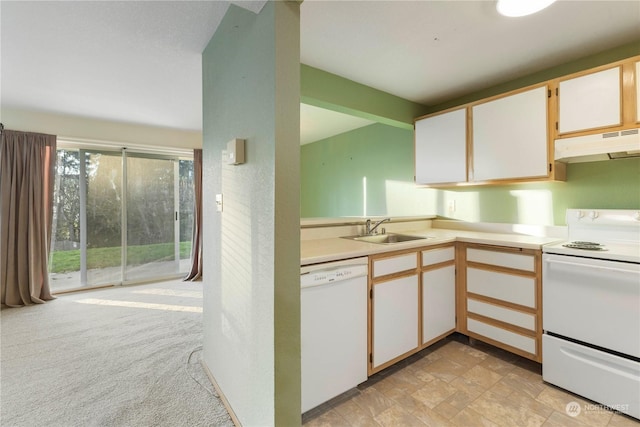 kitchen with white cabinetry, white appliances, light colored carpet, and sink