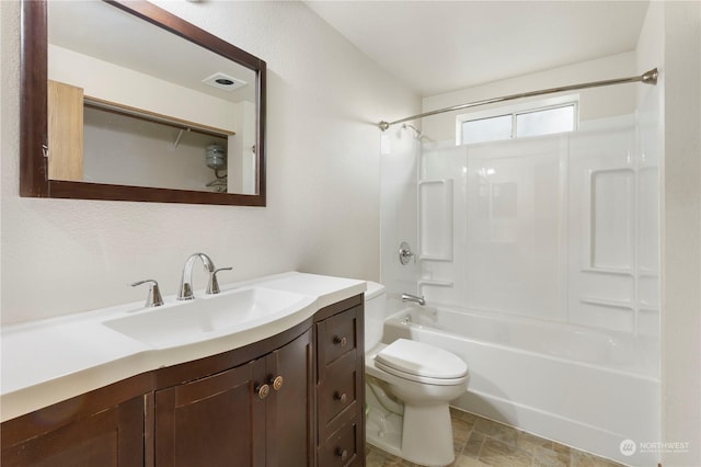 full bathroom with vanity, washtub / shower combination, and toilet