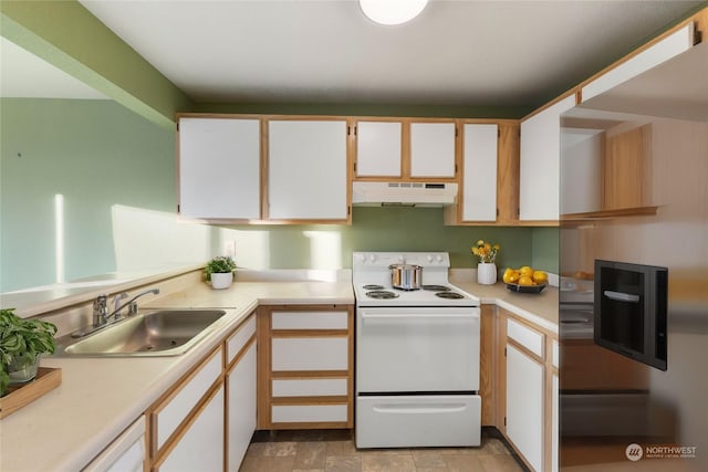 kitchen featuring sink, white cabinets, and white range with electric stovetop