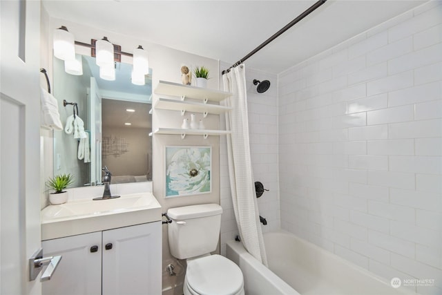 bathroom with vanity, shower / tub combo, and toilet