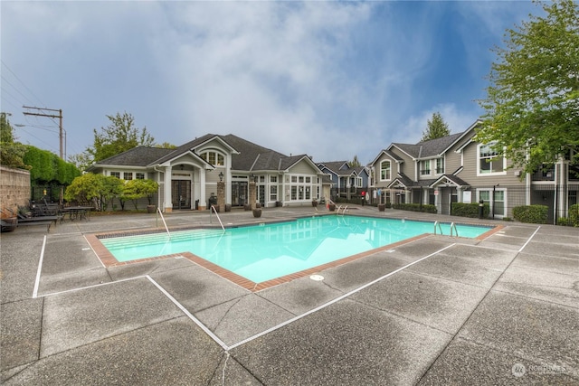 view of swimming pool with a patio