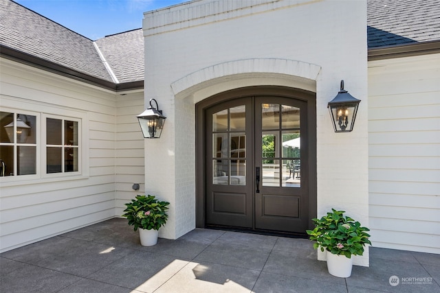 property entrance featuring french doors