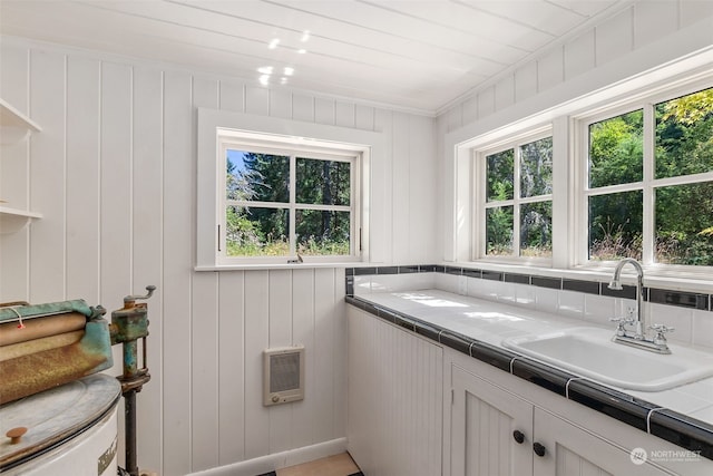 bathroom featuring sink and heating unit