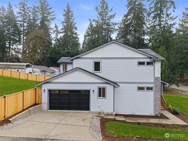 view of front facade featuring a garage and a front lawn