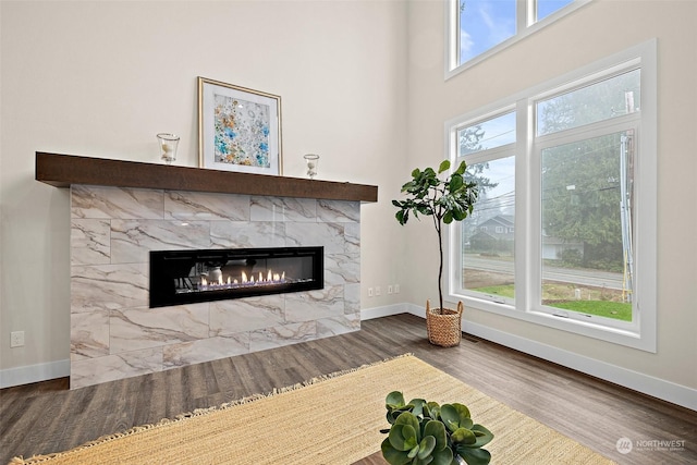 unfurnished living room featuring a fireplace and hardwood / wood-style floors