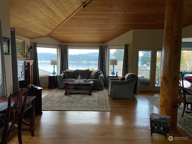 living room featuring lofted ceiling, wooden ceiling, and light hardwood / wood-style floors