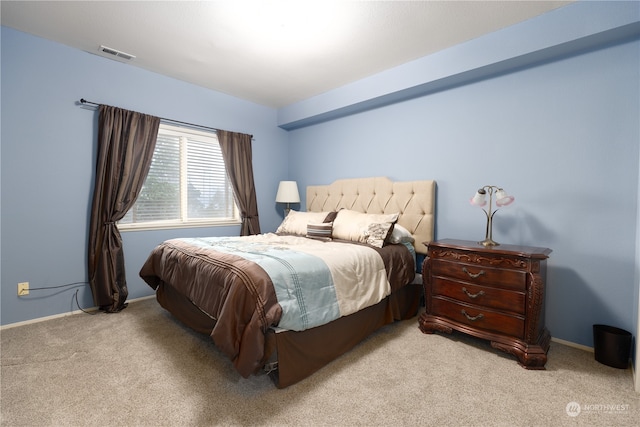 bedroom with light carpet