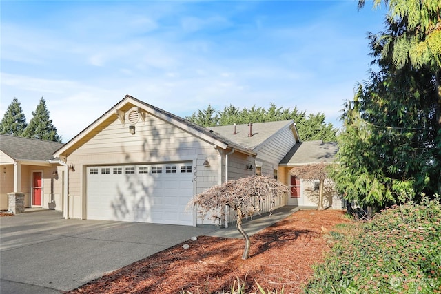 ranch-style home with a garage