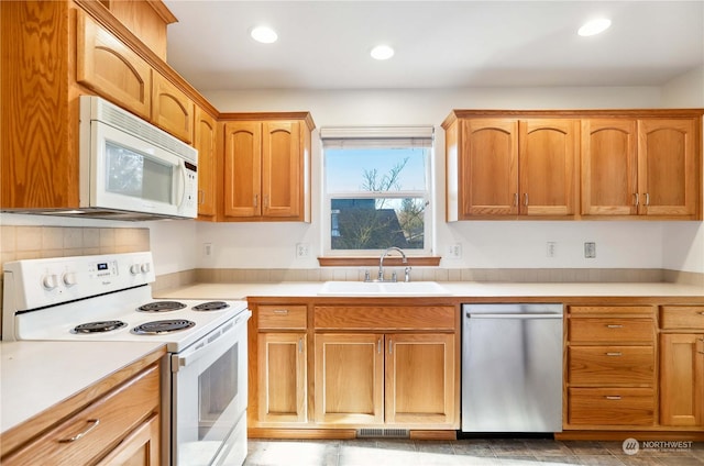 kitchen with sink and white appliances