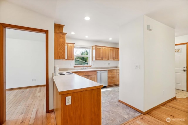 kitchen featuring sink, white electric range oven, dishwasher, and light wood-type flooring