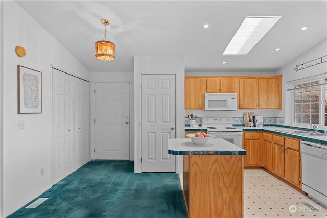 kitchen featuring white appliances, light colored carpet, sink, decorative light fixtures, and a center island