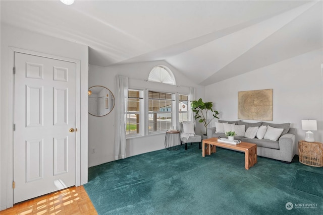 living room featuring plenty of natural light and vaulted ceiling