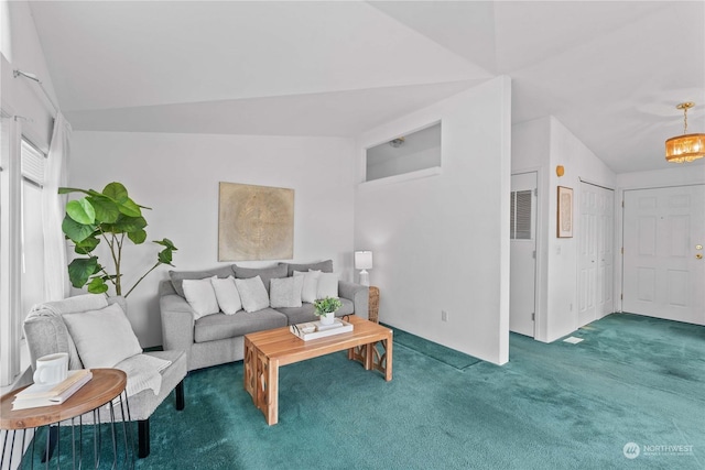 living room with dark carpet and vaulted ceiling