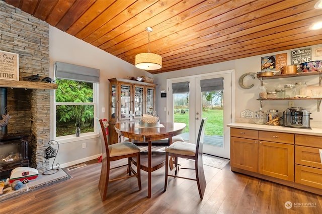 dining room with dark hardwood / wood-style flooring, french doors, wood ceiling, and lofted ceiling