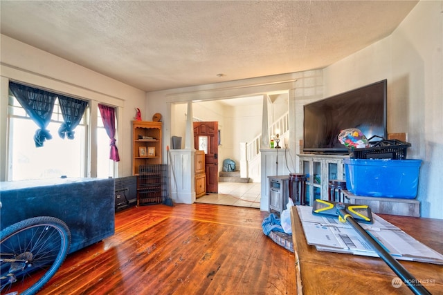 office area featuring hardwood / wood-style floors and a textured ceiling