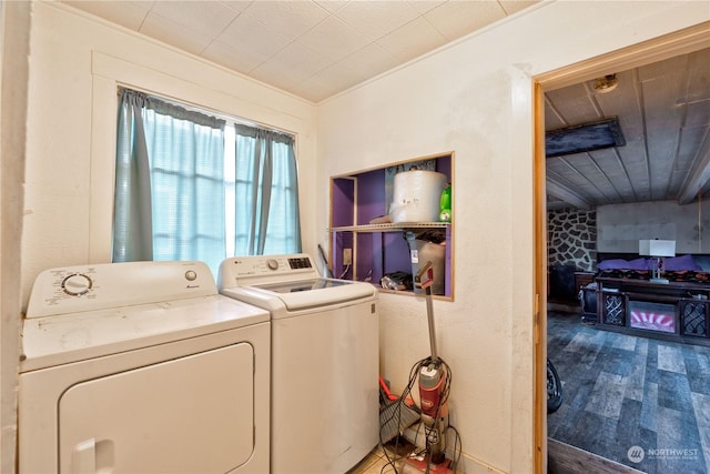 washroom with independent washer and dryer and hardwood / wood-style floors