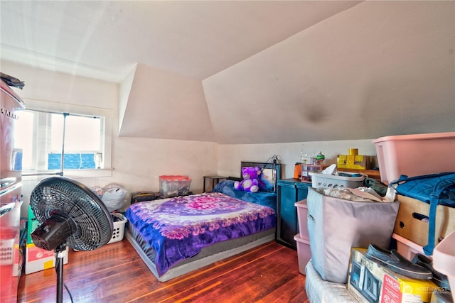 bedroom featuring dark hardwood / wood-style floors and lofted ceiling