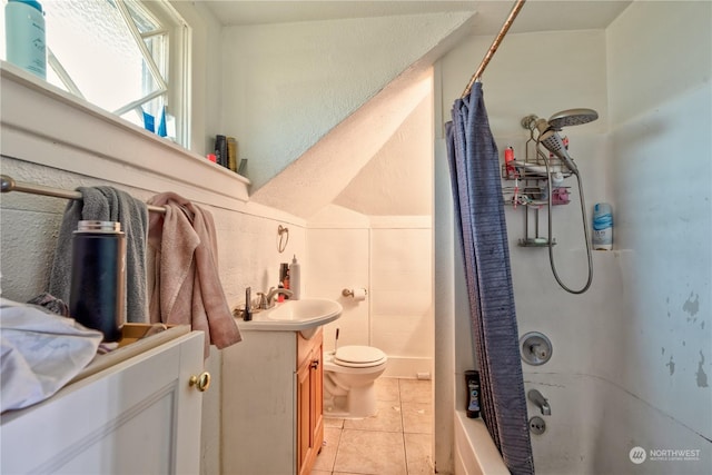 full bathroom featuring vanity, toilet, tile patterned floors, and shower / bathtub combination with curtain